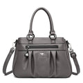 Bolsa Tote Estruturada Feminina Couro Radiance cinza. Zíper frontal, pregas, ferragens prateadas. Elegante e funcional para o dia a dia.