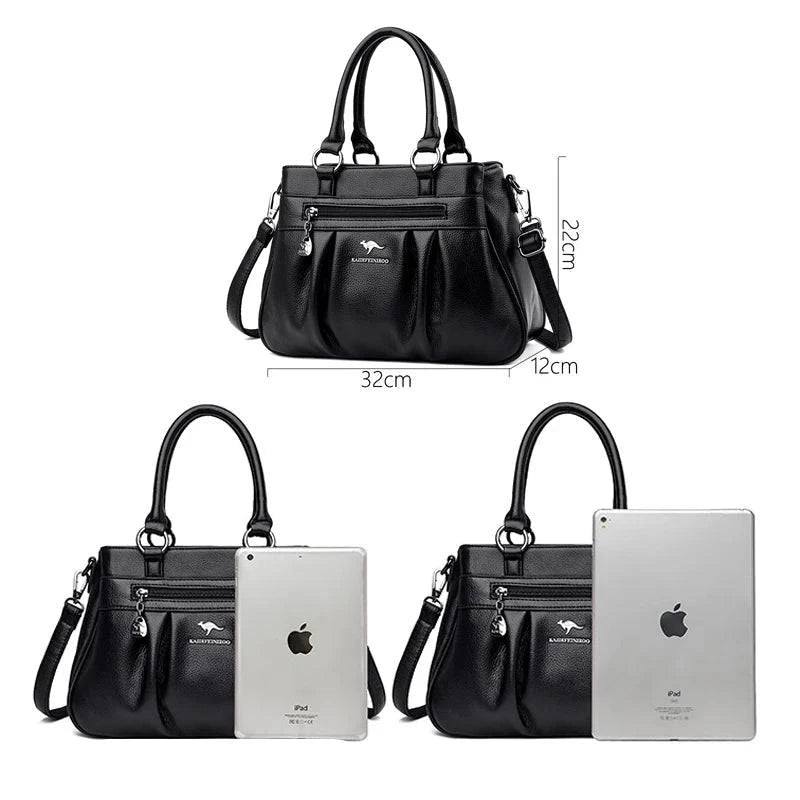 Bolsa Tote Estruturada Feminina Couro Radiance preta. Dimensões: 32x22x12cm. Espaçosa, ideal para iPad, com zíper frontal e alças confortáveis.