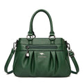 Bolsa Tote Estruturada Feminina Couro Radiance verde-escuro. Zíper frontal, pregas, ferragens prateadas. Elegante e funcional para o dia a dia.