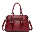 Bolsa Tote Estruturada Feminina Couro Radiance vinho. Zíper frontal, pregas, ferragens prateadas. Elegante e funcional para o dia a dia.