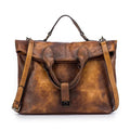 Bolsa Tote Feminina Couro Legítimo Motaora marrom-escuro, com efeito vintage. Design estruturado, alça de mão e fecho metálico. Luxuosa e única.