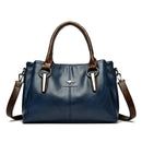 Bolsa tote feminina de couro azul-marinho com alças marrom e alça transversal ajustável