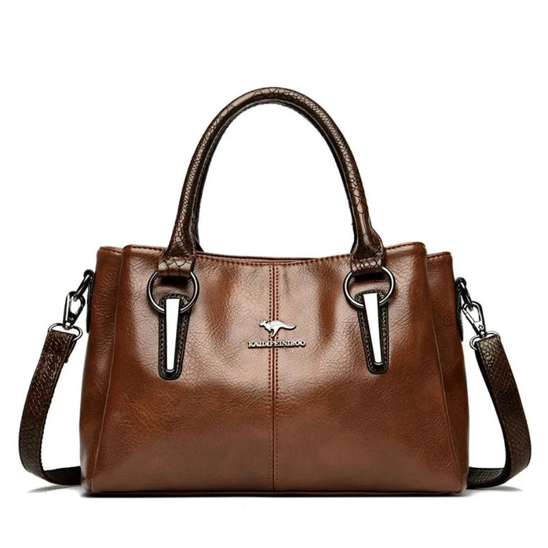 Bolsa Tote Feminina Couro Sublime marrom, acabamento brilhante. Alças duplas com textura, ferragens metálicas e logo. Elegante e versátil.