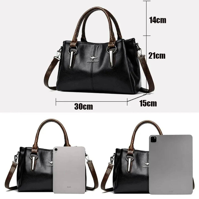 Bolsa Tote Feminina Couro Sublime preta. Dimensões: 30x21x15cm. Ideal para tablet. Alças duplas marrom, ferragens metálicas. Elegante e espaçosa.