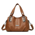 Bolsa Tote Feminina Estruturada Pequena caramelo, couro macio, ferragens prateadas. Versátil e charmosa.
