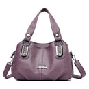Bolsa tote estruturada roxo com alças duplas, ferragens prateadas e alça transversal