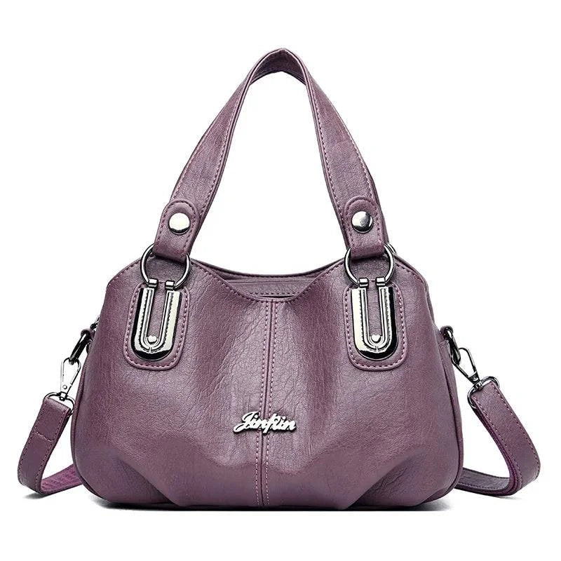 Bolsa Tote Feminina Estruturada Pequena lilás, couro macio, ferragens prateadas. Prática e charmosa.