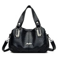 Bolsa Tote Feminina Estruturada Pequena preta, couro macio, ferragens prateadas. Versátil e elegante.