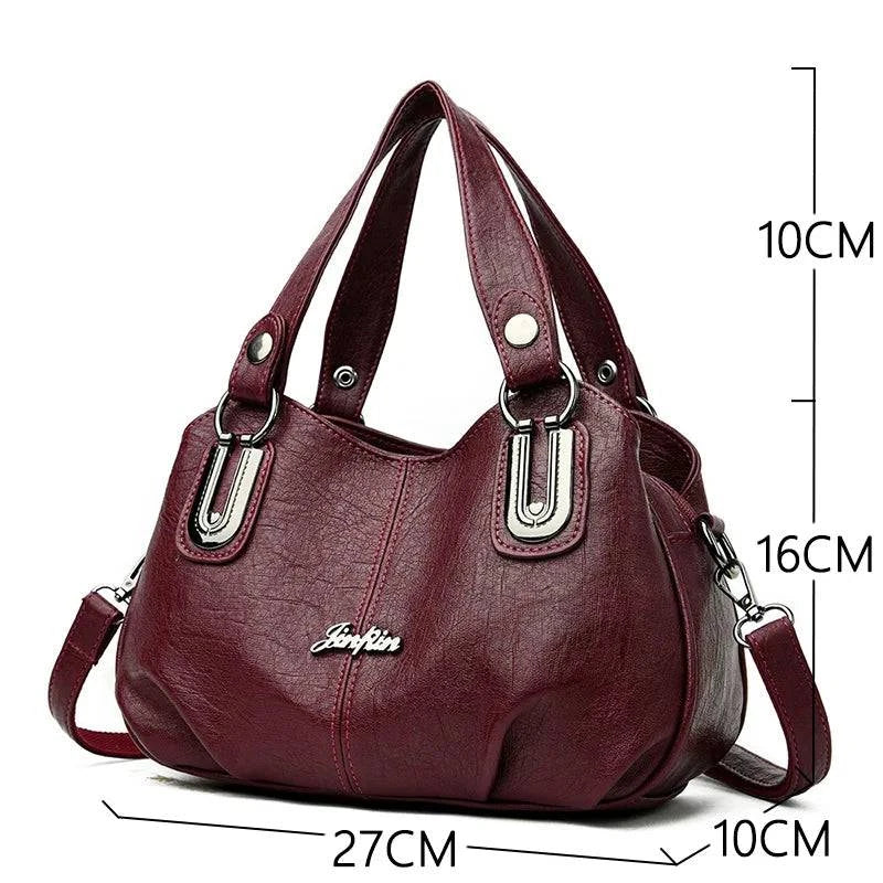 Bolsa Tote Feminina Estruturada Pequena vinho, couro macio, ferragens prateadas. Dimensões: 27x16x10cm.