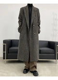 Sobretudo masculino longo social cinza com abotoamento duplo, perfeito para moda outono/inverno com toque europeu.